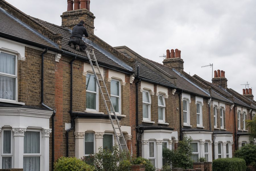 Roof repair work on terraced housing in Plaistow
